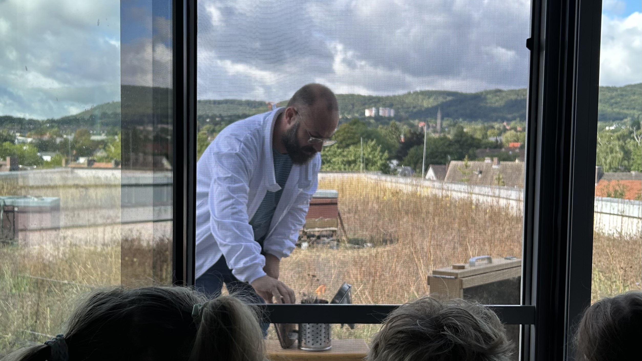 The city beekeeper of Kassel with his prepared smoker.